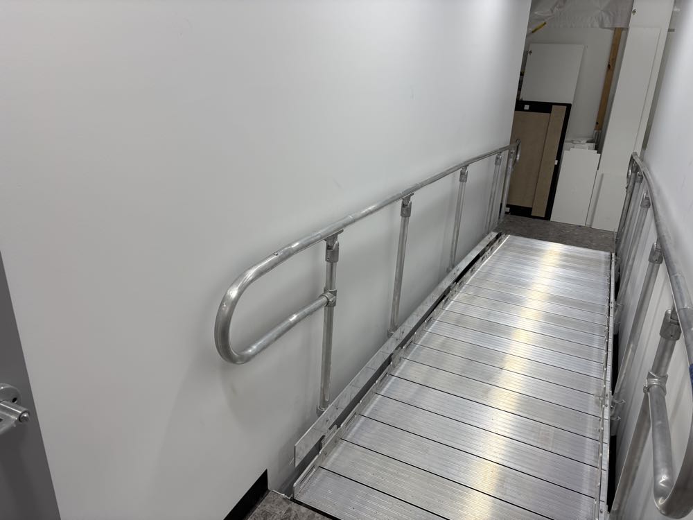 Slip-resistant extruded deck with handrails to both sides.